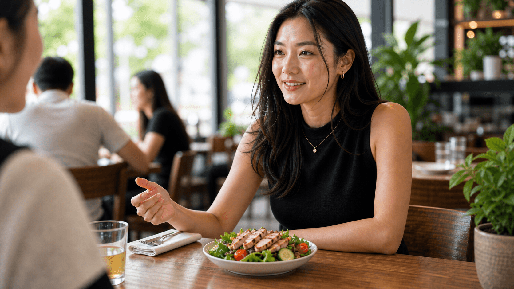 Young woman having lunch with a friend
